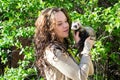 The girl with the polecat in hands Royalty Free Stock Photo