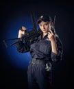 The girl in the police uniform with a gun is a Russian policeman with gun. English translation of Police Royalty Free Stock Photo