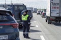 Girl is a policeman watching traffic. Royalty Free Stock Photo