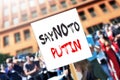 Girl with political banner Message Say no to Putin at protest rally. Reportageeditorial photo for the war between Russia and Ukrai