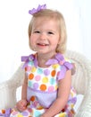 Girl in Polka Dot Dress on Chair