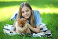 Girl with pomeranian dog