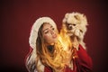 girl with pomeranian spitz dog at xmas.