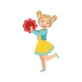 Girl With Ponytails Playing Tambourine