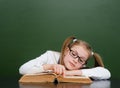 Girl with poor eyesight reading a book