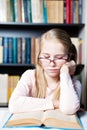 Girl with poor eyesight reading a book