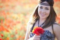 Girl with poppies bunch Royalty Free Stock Photo