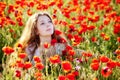Girl on a poppy meadow Royalty Free Stock Photo