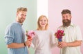 Girl popular receive lot men attention. Girl happy likes gifts. Love triangle. Men competitors with bouquets flowers try Royalty Free Stock Photo