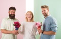 Girl popular receive lot men attention. Girl happy likes gifts. Love triangle. Men competitors with bouquets flowers try Royalty Free Stock Photo