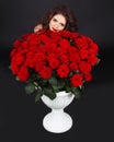 Girl portrait. Bouquet of red roses brunch. Valentine day. Dark Royalty Free Stock Photo