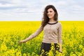 Girl portrait in yellow flower field Royalty Free Stock Photo