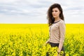 Girl portrait in yellow flower field Royalty Free Stock Photo