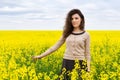 Girl portrait in yellow flower field Royalty Free Stock Photo