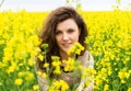 Girl portrait in yellow flower field Royalty Free Stock Photo