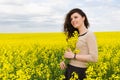 Girl portrait in yellow flower field Royalty Free Stock Photo