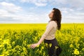 Girl portrait in yellow flower field Royalty Free Stock Photo