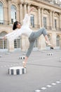 Girl pose on leg on square in paris, france Royalty Free Stock Photo