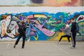 A girl poses for a group of photographers against the background of a wall with graffiti. Cheboksary. Russia Royalty Free Stock Photo