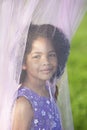 Girl posing behind canopy