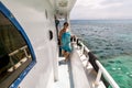 Girl posing on the bow of the yacht in the beautiful sea landscape Royalty Free Stock Photo