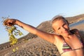 Girl posing with bunch of grapes Royalty Free Stock Photo