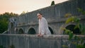 Girl posing castle balcony calm summer evening. Woman leaning on stone railings Royalty Free Stock Photo