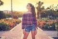 Girl posing in a flowers park garden