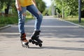 Girl posing while standing on rollers.