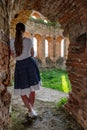 Girl posing in technical ruin. Iron Smelting Plant called Frantiskova Huta in Slovakia