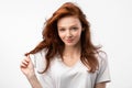 Girl Posing Touching Healthy Red Hair Posing Over White Background Royalty Free Stock Photo