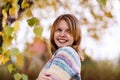 Girl posing under foliage in autumn season Royalty Free Stock Photo