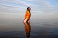 Girl posing in the Water at sunset