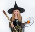 Girl posing in witch dress, Halloween