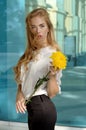 Girl posing with a yellow flower Royalty Free Stock Photo