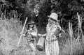 Girl with potted plant. farming and agriculture. spring country side. small girls farmer in village. earth day. summer