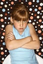 Girl pouting with arms crossed. Royalty Free Stock Photo