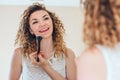 Girl powdering her face Royalty Free Stock Photo