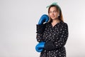 Girl power concept. Confident young woman isolated on gray wall background. Feminine and independent strength.Girl in boxing Royalty Free Stock Photo