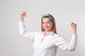 Girl power concept. Confident young woman isolated on gray wall background. Feminine and independent strength Royalty Free Stock Photo