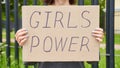 Girl Power concept. Unrecognizable person holds sign with text about feminism Royalty Free Stock Photo