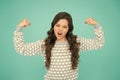 Girl power. Little girl flex arms blue background. Small girl with long hair show strength. Fit and fitness. Beauty and