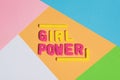 GIRL POWER writing on a colorful pastel background