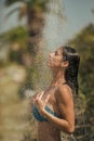 Girl Powered. Issues face girls. Water drops falling on attractive woman. Young beautiful brunette girl taking shower on Royalty Free Stock Photo