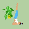 Girl practices yoga at home during quarantine. A young brunette woman in a tracksuit makes an asana candle pose. Doing sports Royalty Free Stock Photo