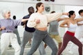 Girl practicing punches during group self defense course Royalty Free Stock Photo