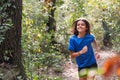 girl practicing trail running in the woods Royalty Free Stock Photo