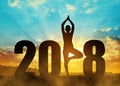 Girl practicing yoga in the New Year 2018. Royalty Free Stock Photo