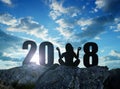 Girl practicing yoga on rock in the New Year 2018. Royalty Free Stock Photo