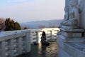 Girl praying in front of Buddha statue at Myohoji Temple Pagoda of Beppu.